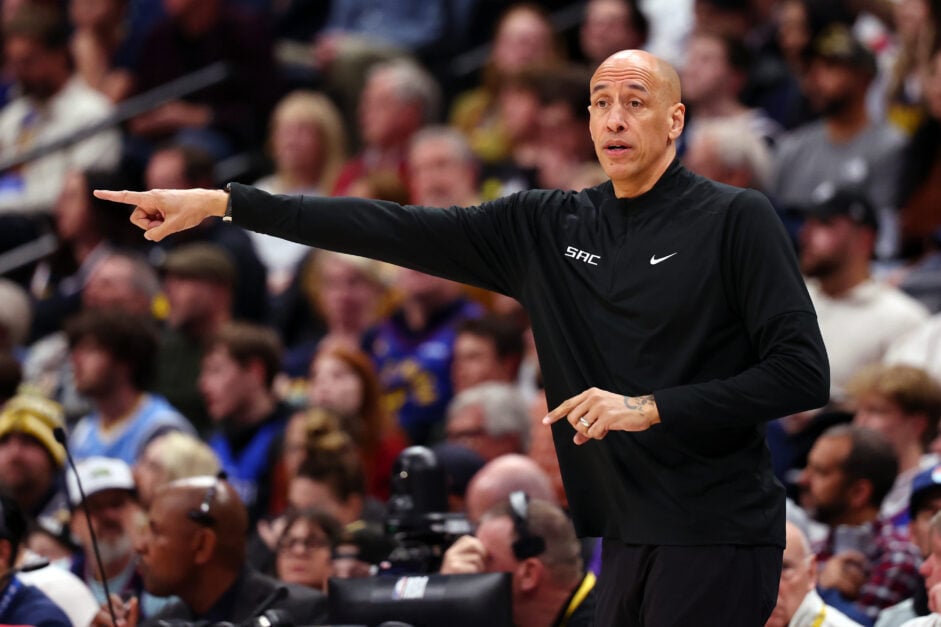 Head Coach Doug Christie of the Sacramento Kings gestures in a game against the Denver Nuggets during the third quarter at Ball Arena.
