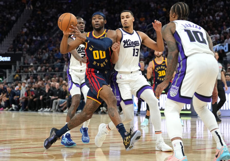 Jonathan Kuminga #00 of the Golden State Warriors passes the ball against the Sacramento Kings during the fourth quarter of an NBA basketball game at Chase Center on March 13, 2025 in San Francisco, California.