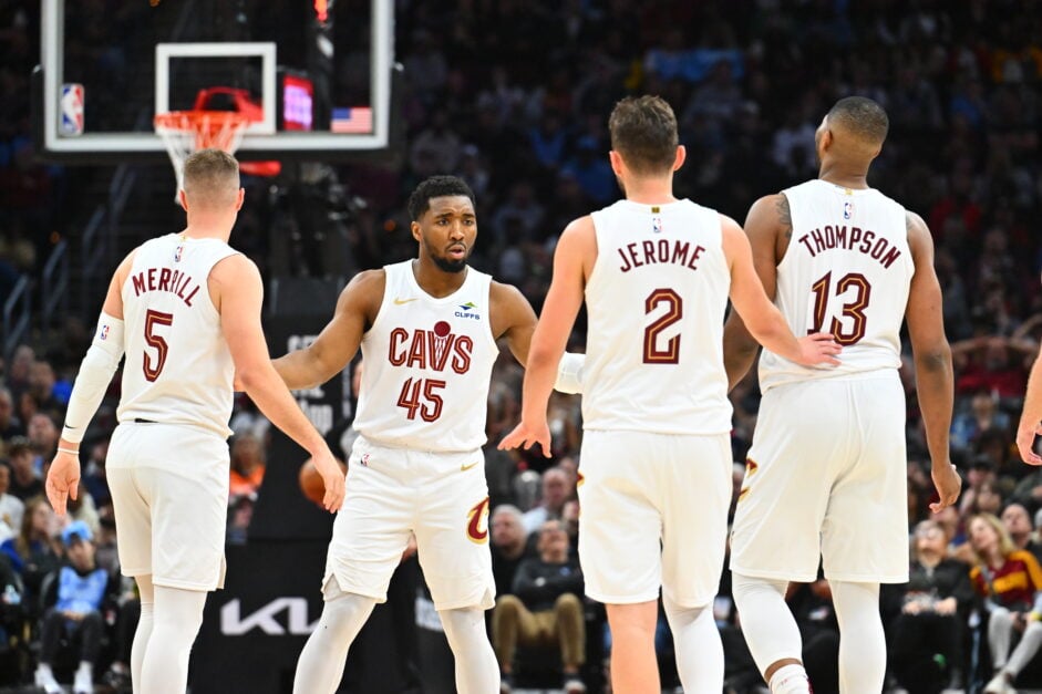 Donovan Mitchell #45 celebrates with Sam Merrill #5 Ty Jerome #2 Tristan Thompson #13 of the Cleveland Cavaliers during the third quarter against the Orlando Magic at Rocket Arena on March 16, 2025 in Cleveland, Ohio. The Magic defeated the Cavaliers 108-103.