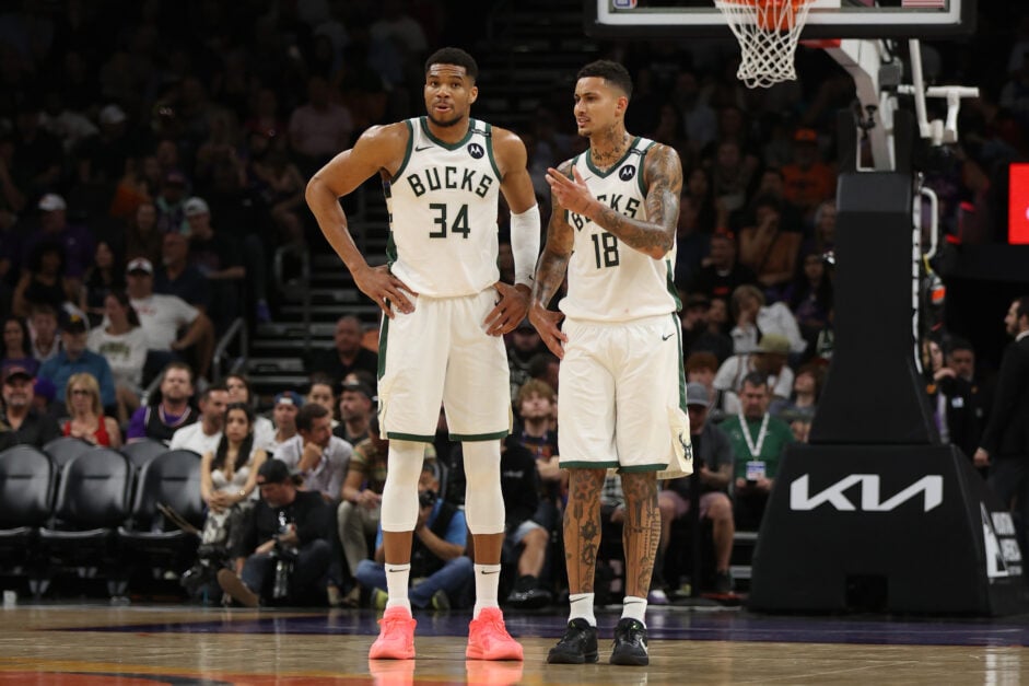 Giannis Antetokounmpo #34 of the Milwaukee Bucks stands next to Kyle Kuzma #18 during the first half against the Phoenix Suns.