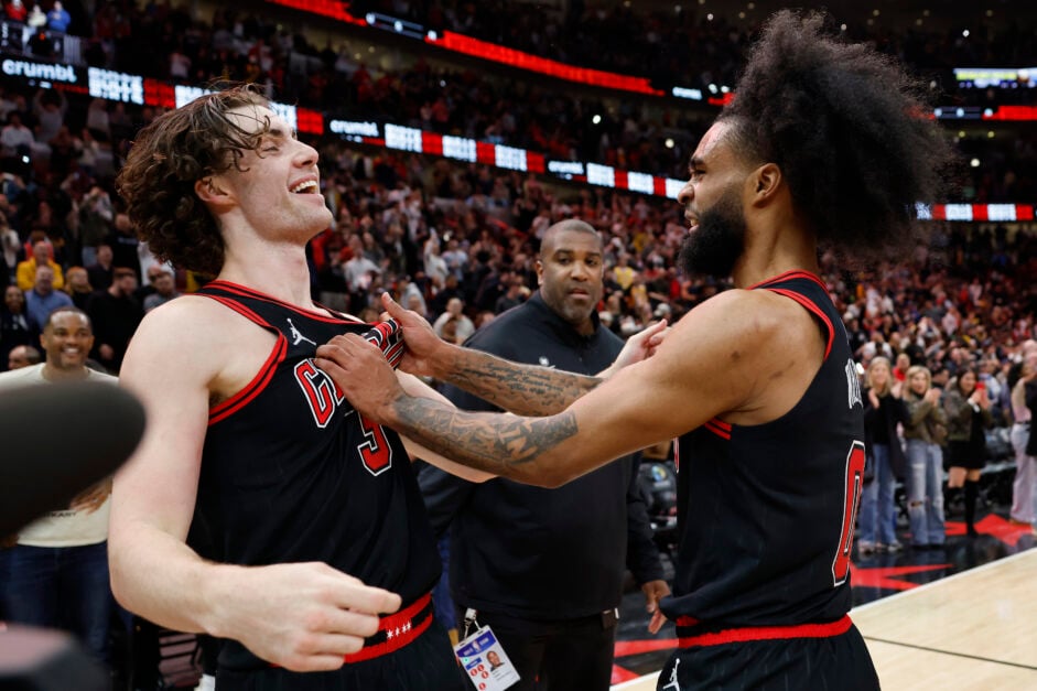 Josh Giddey #3 of the Chicago Bulls celebrates a game-winning three pointer with Coby White #0 against the Los Angeles Lakers.