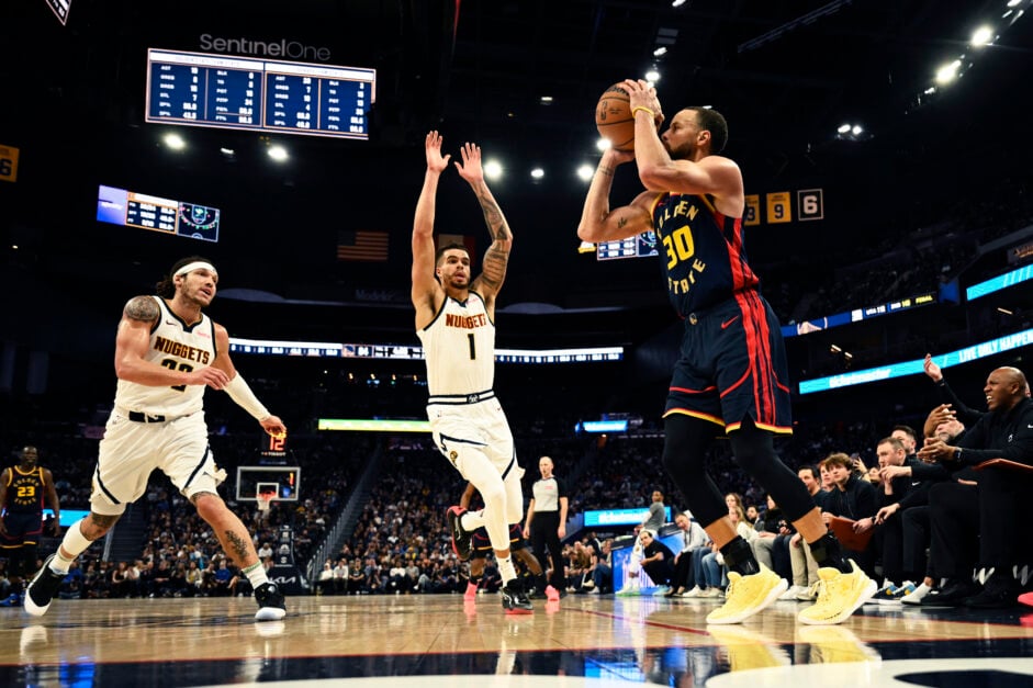Stephen Curry #30 of the Golden State Warriors hits a three point basket against Michael Porter Jr. #1 of the Denver Nuggets in the third quarter at Chase Center on April 04, 2025 in San Francisco, California.