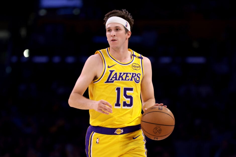 Austin Reaves #15 of the Los Angeles Lakers brings the ball up court during the second quarter against the Houston Rockets.