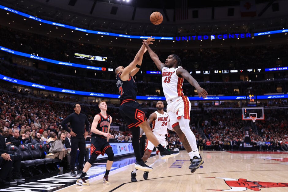 Talen Horton-Tucker #22 of the Chicago Bulls takes a shot against Davion Mitchell #45 of the Miami Heat of an NBA play-in tournament game