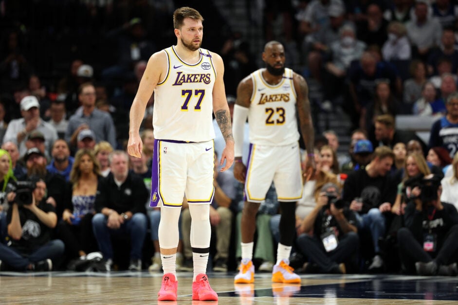 Luka Doncic #77 and LeBron James #23 of the Los Angeles Lakers look on against the Minnesota Timberwolves in the third quarter of Game Four of the First Round of the 2025 NBA Playoffs.