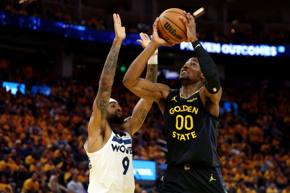 Jonathan Kuminga #00 of the Golden State Warriors shoots the ball against Nickeil Alexander-Walker #9 of the Minnesota Timberwolves during the fourth quarter in Game Four of the Western Conference Second Round NBA Playoffs at Chase Center.