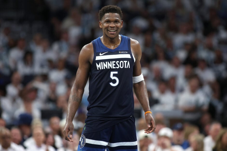 Anthony Edwards #5 of the Minnesota Timberwolves smiles against the Golden State Warriors during the third quarter in Game Five of the Western Conference Second Round NBA Playoffs at Target Center.