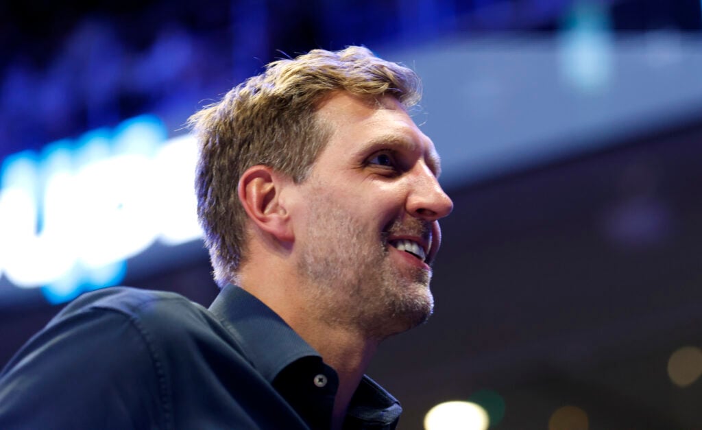 Dallas Mavericks icon Dirk Nowitzki watching a Dallas Wings WNBA game.