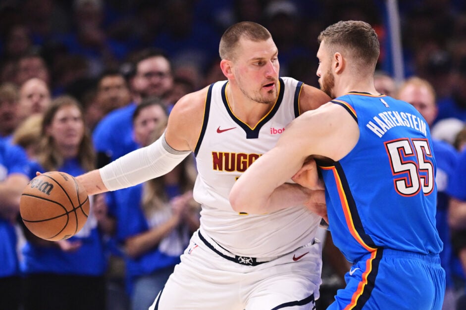 Nikola Jokic #15 of the Denver Nuggets works against Isaiah Hartenstein #55 of the Oklahoma City Thunder