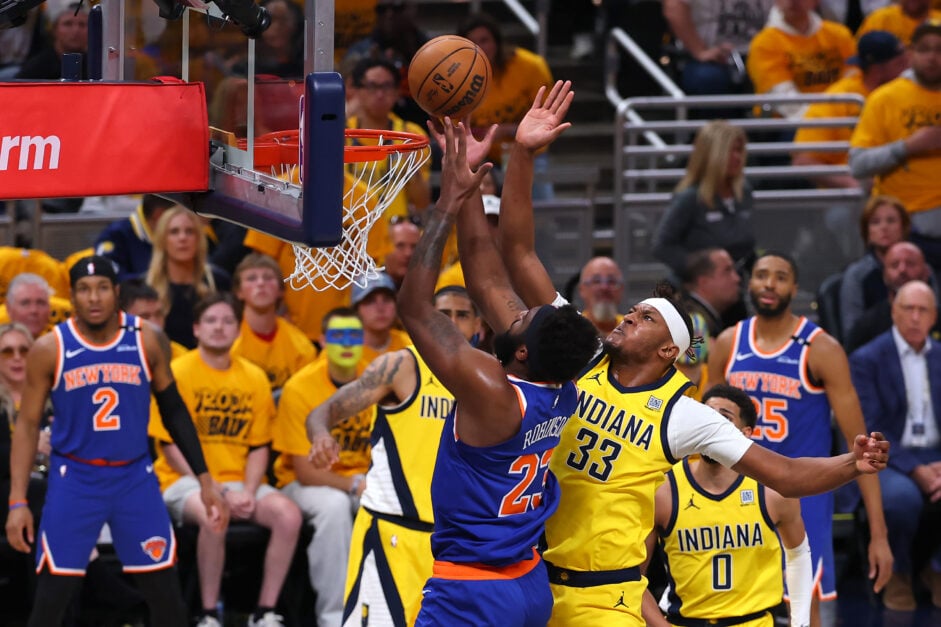 Myles Turner #33 of the Indiana Pacers defends against Mitchell Robinson #23 of the New York Knicks during the first quarter in Game Three of the Eastern Conference Finals.