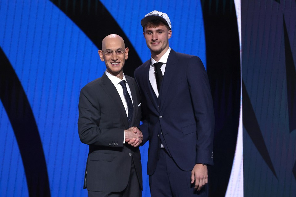 NEW YORK, NEW YORK - JUNE 25: Cooper Flagg (R) shakes hands with NBA commissioner Adam Silver (L) after being drafted first overall by the Dallas Mavericks during the first round of the 2025 NBA Draft at Barclays Center on June 25, 2025 in the Brooklyn borough of New York City. NOTE TO USER: User expressly acknowledges and agrees that, by downloading and/or using this photograph, user is consenting to the terms and conditions of the Getty Images License Agreement. (Photo by Sarah Stier/Getty Images)