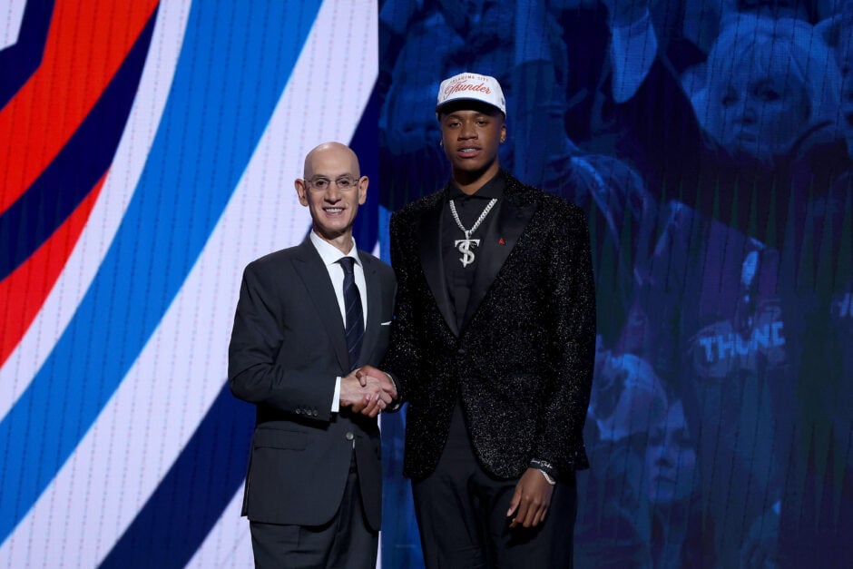 Thomas Sorber shakes Adam Silver's hand after being drafted by the OKC Thunder