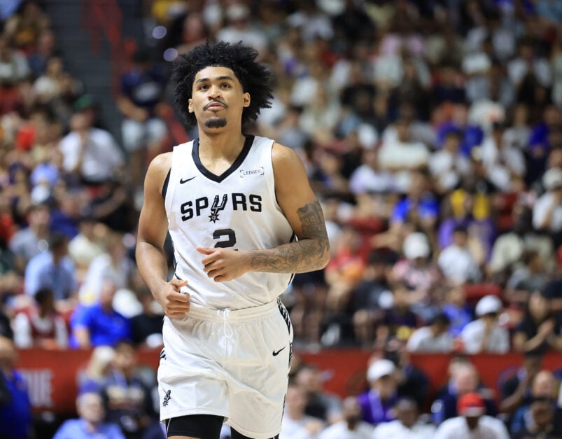 Dylan Harper #2 of the San Antonio Spurs walks on the court during a break in the first half of a 2025 NBA Summer League game.