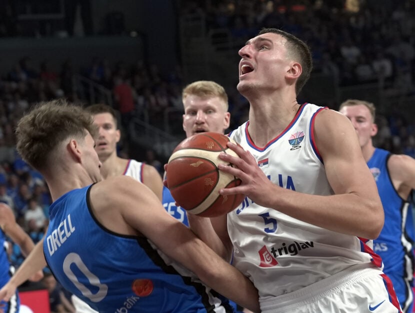 Serbia's Nikola Jovic (5) competes with Henri Drell (0) of Estonia during the Group A third match of the FIBA EuroBasket 2025 between Serbia and Estonia at Riga Arena, on August 27, 2025 in Riga, Latvia.