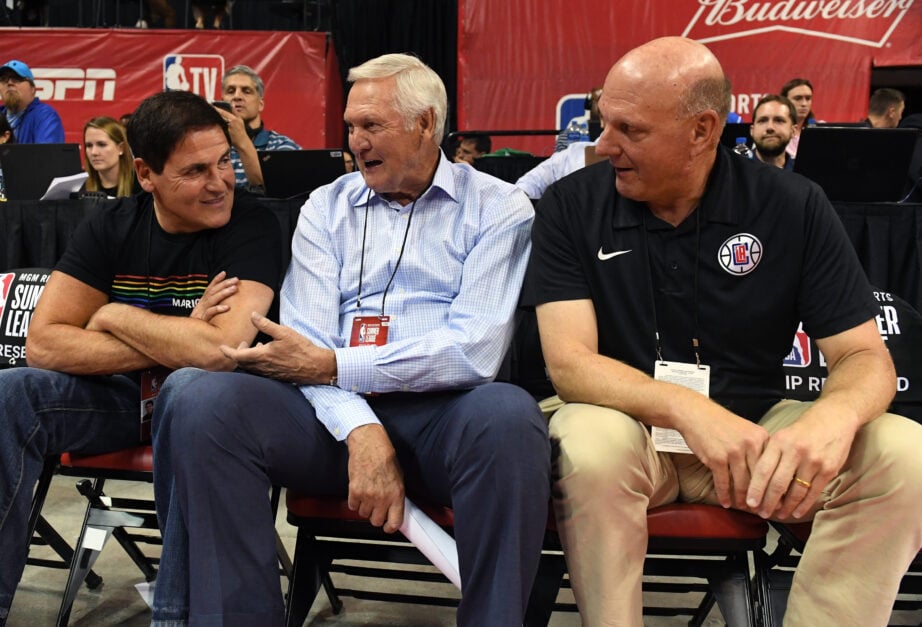 Dallas Mavericks owner Mark Cuban, Los Angeles Clippers executive board member Jerry West and Clippers owner Steve Ballmer watch a 2018 NBA Summer League game between the Mavericks and the Phoenix Suns at the Thomas & Mack Center on July 6, 2018 in Las Vegas, Nevada.