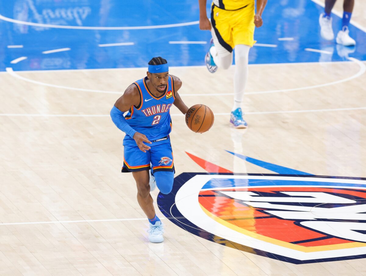 Oklahoma City Thunder guard Shai Gilgeous-Alexander (2) dribbles the ball against the Indiana Pacers during the first half of game seven of the 2025 NBA Finals at Paycom Center.