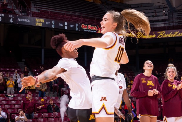 Niamya Holloway celebrates with Mara Braun after Braun beat Lehigh with a last-second 3-pointer at Williams Arena on Nov. 13, 2022. (Gophers Athletics)