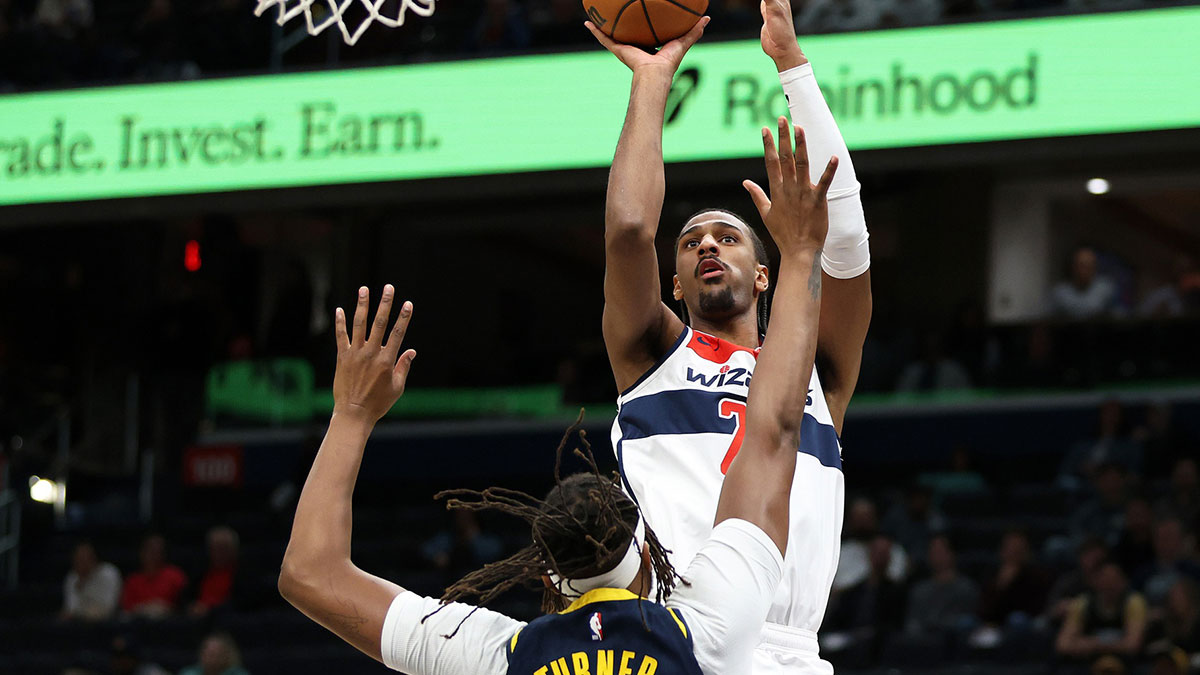 Washington Wizards forward Alex Sarr (20) takes a shot over Indiana Pacers center Myles Turner (33) during the first half at Capital One Arena.