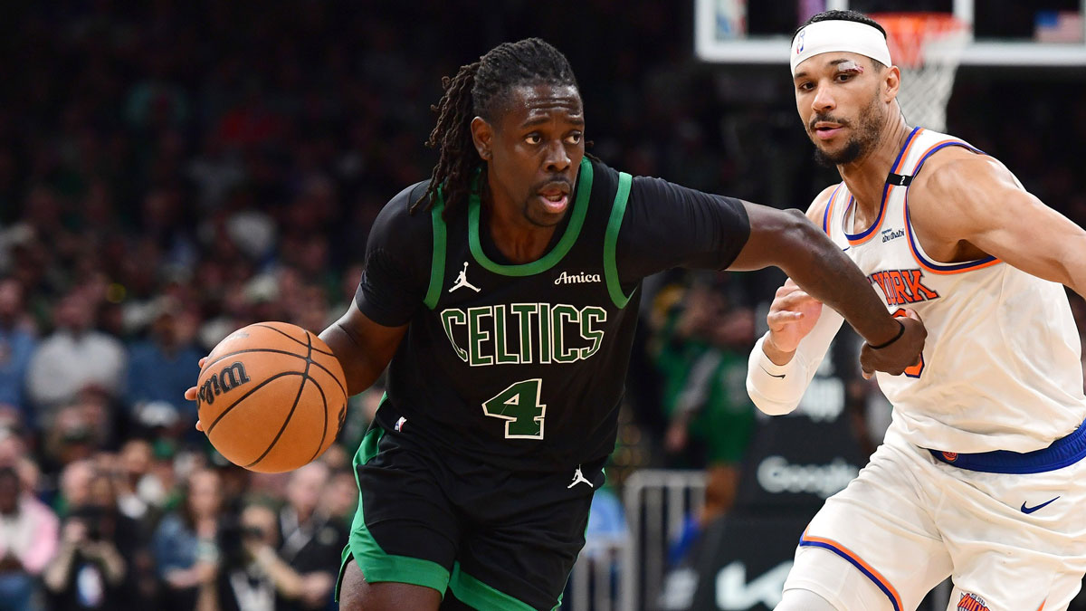Boston Celtics guard Jrue Holiday (4) controls the ball while New York Knicks guard Josh Hart (3) defends in the second half during game five of the second round for the 2025 NBA Playoffs at TD Garden. 