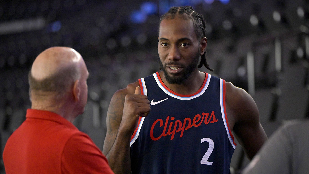 Los Angeles Clippers forward Kawhi Leonard (2) talks with team owner Steve Ballmer during media day at Intuit Dome.