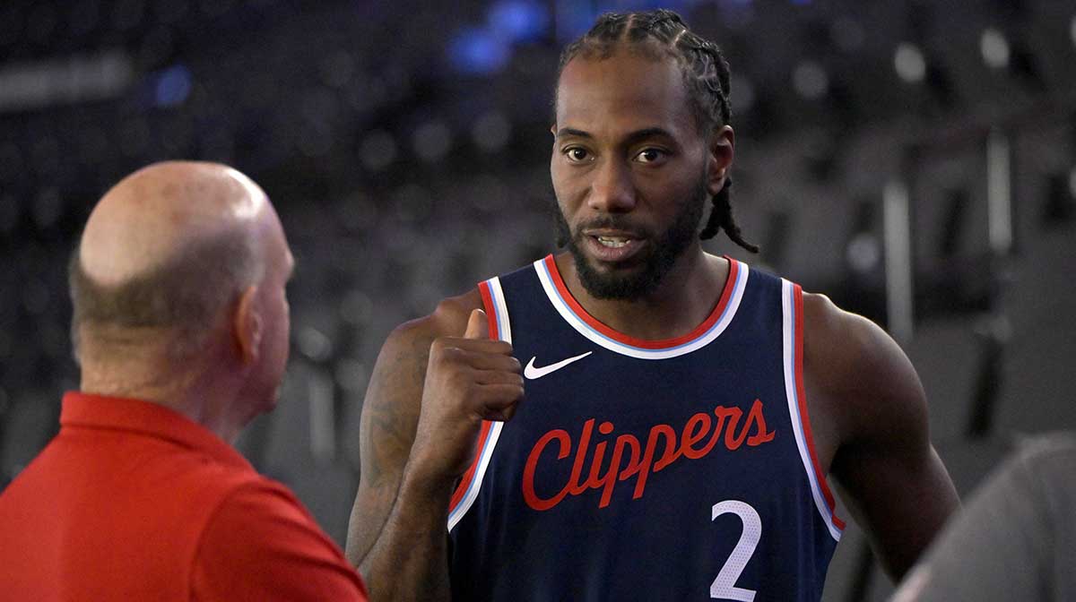 Los Angeles Clippers forward Kawhi Leonard (2) talks with team owner Steve Ballmer during media day at Intuit Dome.
