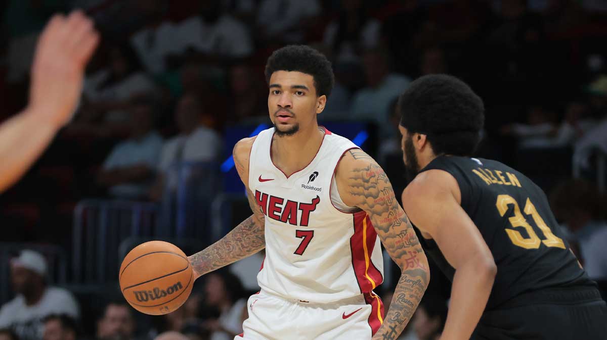 Miami Heat center Kel'el Ware (7) dribbles the basketball as Cleveland Cavaliers center Jarrett Allen (31) defends in the third quarter during game three for the first round of the 2025 NBA Playoffs at Kaseya Center.