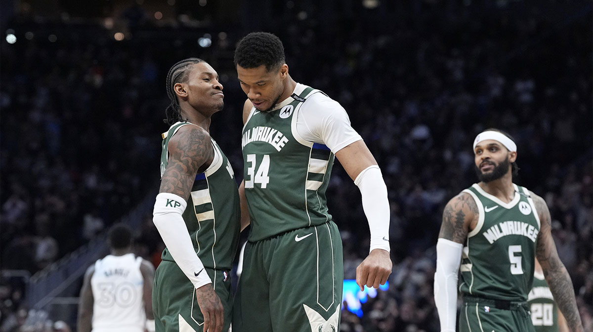 Milwaukee Bucks guard Kevin Porter Jr. (3) and Milwaukee Bucks forward Giannis Antetokounmpo (34) celebrate as the clock winds down in their 110-103 comeback victory over the Minnesota Timberwolves at Fiserv Forum.