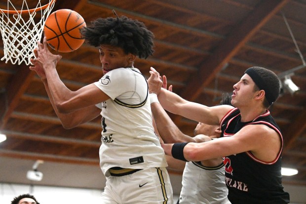 Notre Dame's Zach White and Joe Sterling of Harvard-Westlake battle for a rebound Jan. 24, 2025.(Photo by Andy Holzman, Contributing Photographer)
