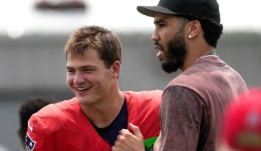 The Celtics' Jayson Tatum (right), who is walking normally again after tearing his Achilles' tendon in the playoffs, visited with Drake Maye during Patriots training camp in August.