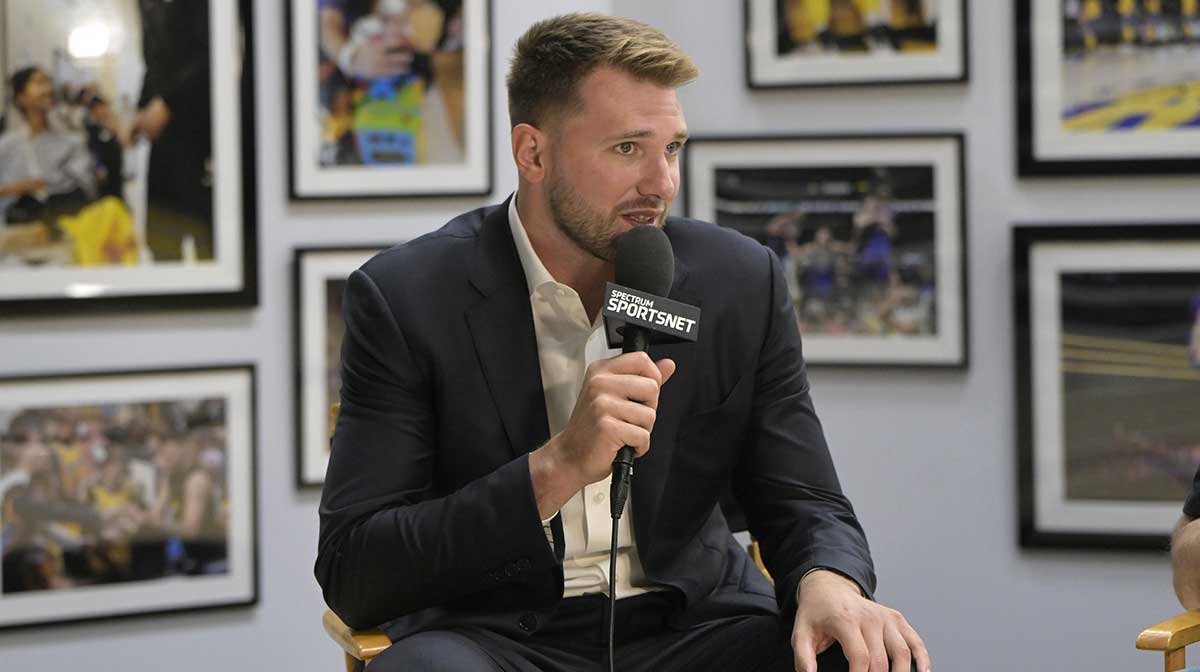 Lakers Luka Doncic (77) is interviewed Spectrum SportsNet following a press conference announcing the signing of his contract extension at UCLA Health Training Center