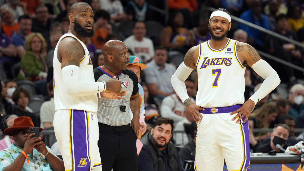 Los Angeles Lakers forward LeBron James (6) and forward Carmelo Anthony (7) argue a call with an official during the first half of the game against the Phoenix Suns at Footprint Center.