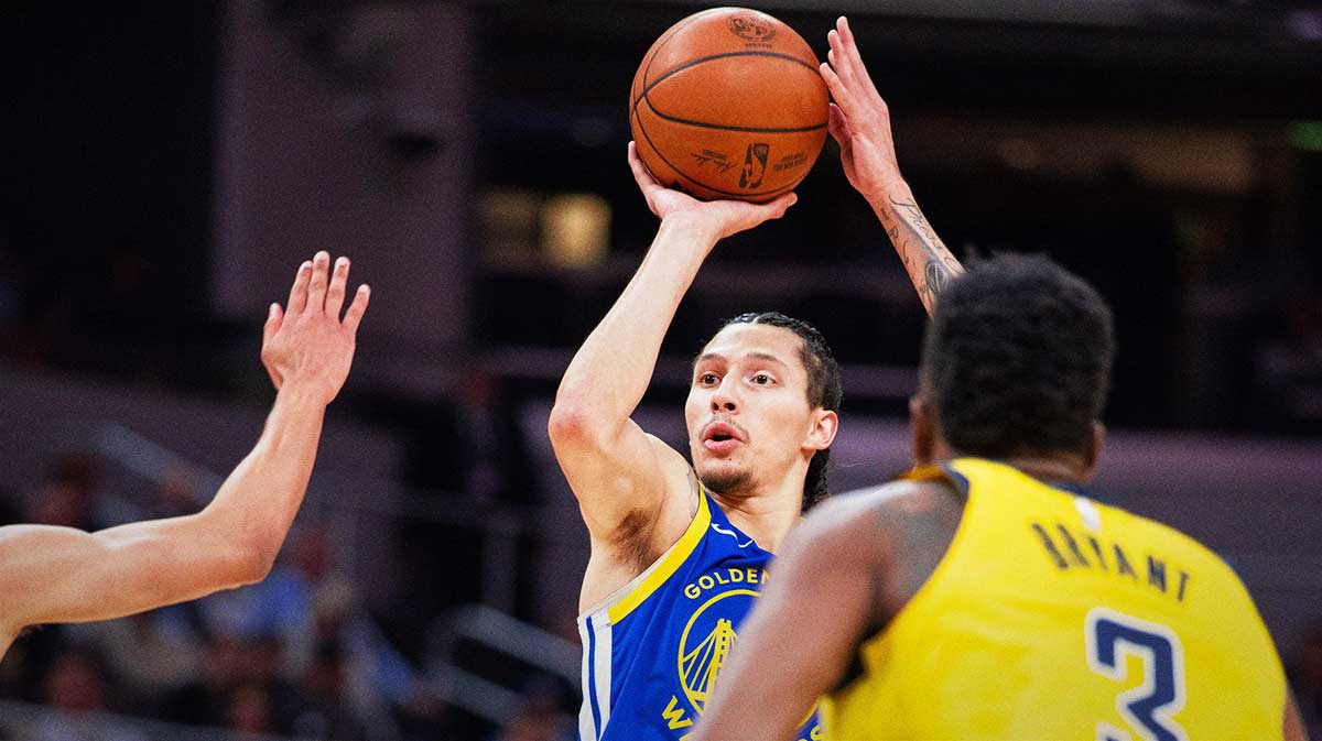 Golden State Warriors forward Lindy Waters III (43) shoots the ball while Indiana Pacers center Thomas Bryant (3) defends in the first half at Gainbridge Fieldhouse.