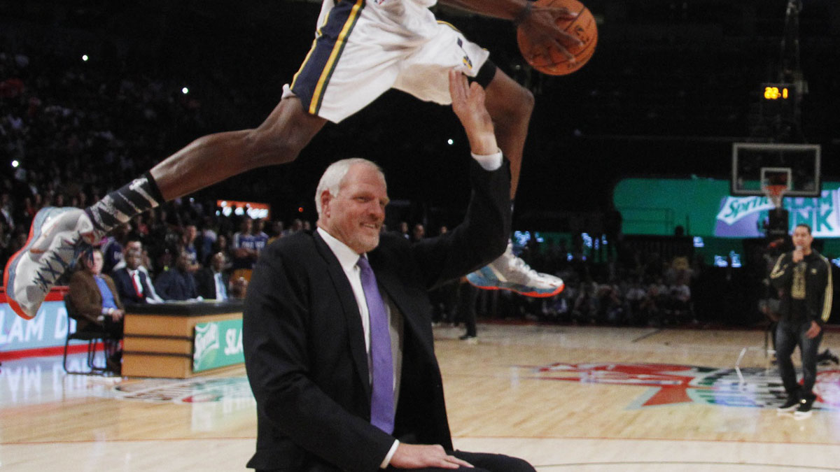Utah Jazz forward Jeremy Evans (40) jumps over former Jazz center Mark Eaton during the 2013 NBA All-Star slam dunk contest at the Toyota Center.