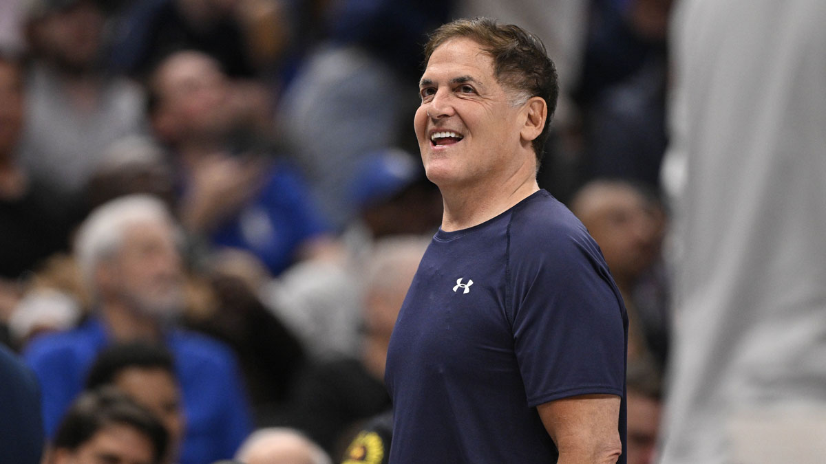 Mavericks minority owner Mark Cuban looks on during the second half against the Toronto Raptors at the American Airlines Center with Pablo Torre and Kawhi Leonard in the background
