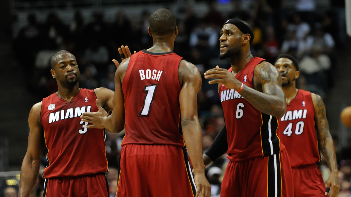 Miami Heat forward LeBron James (6) reacts with center Chris Bosh (1) and guard Dwyane Wade (3) after a Heat basket during the game against the Milwaukee Bucks at the Bradley Center. The Heat beat the Bucks 107-94.