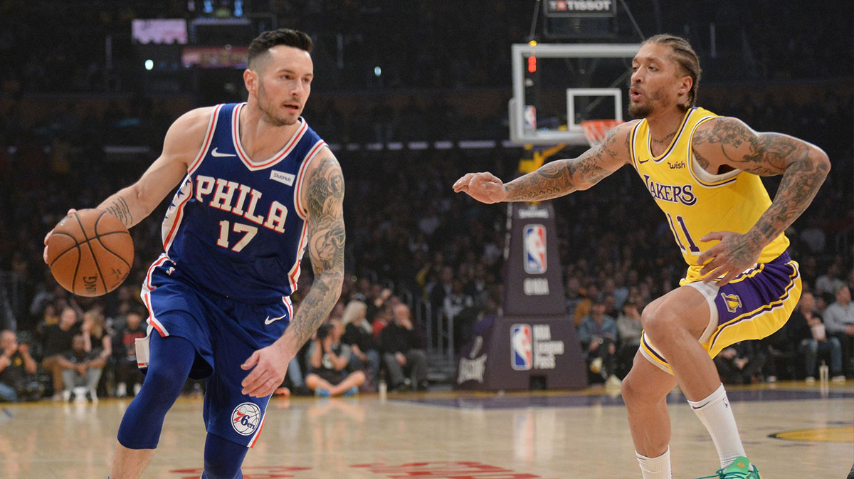 Los Angeles Lakers forward Michael Beasley (11) shoots the basketball against Golden State Warriors forward Andre Iguodala (9) during the second quarter at Oracle Arena.