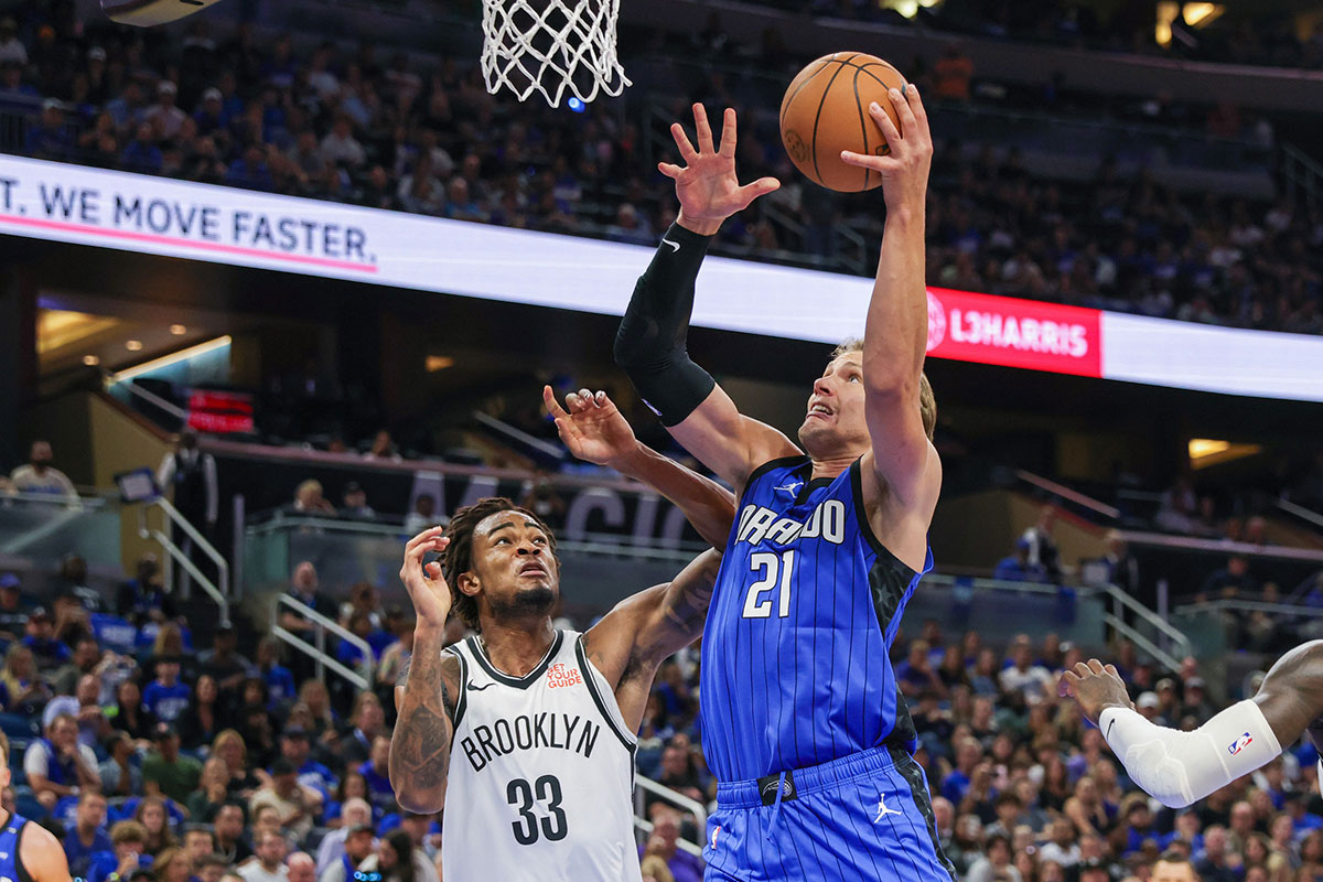 Orlando Magic center Moritz Wagner (21) goes to the basket against Brooklyn Nets center Nic Claxton (33) during the second half at Kia Center.