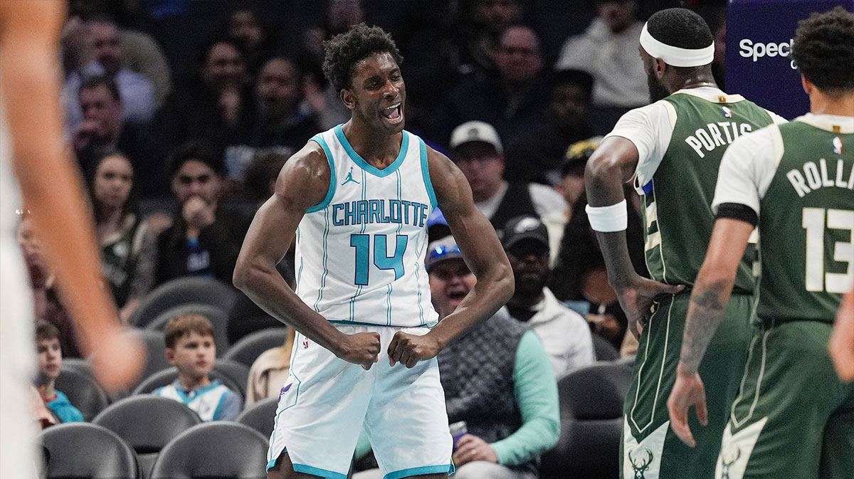 Charlotte Hornets forward Moussa Diabate (14) reacts to his three point play against the Milwaukee Bucks during the second quarter at Spectrum Center.