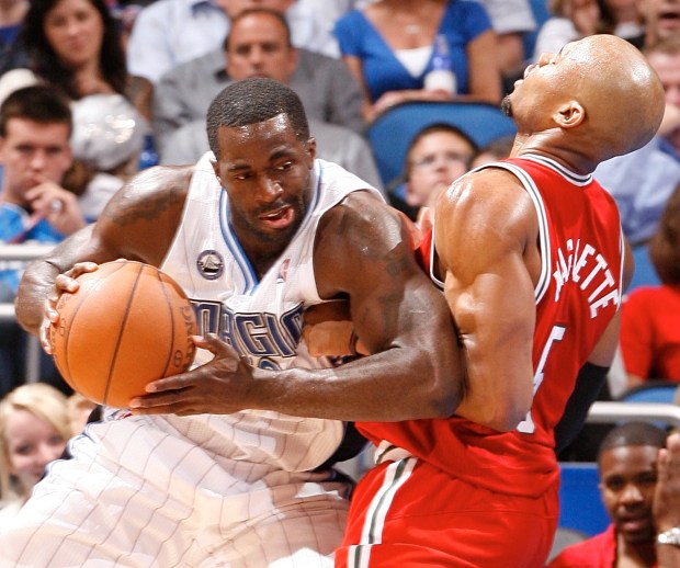 Orlando forward Brandon Bass bangs into Milwaukee forward Corey Maggette during the Magic's 78-72 victory over the Bucks in an NBA basketball game at Amway Center in Orlando, Fla. Tuesday, April 5, 2011. (Gary W. Green/staff photographer) ORG XMIT: B581173612Z.1
