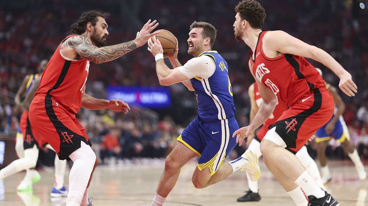 Golden State Warriors guard Pat Spencer (61) drives with the ball as Houston Rockets center Steven Adams (12) defends during game two of the first round for the 2024 NBA Playoffs at Toyota Center.
