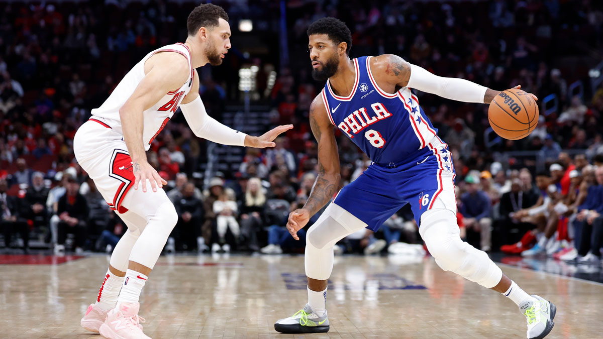 Philadelphia 76ers forward Paul George (8) is defended by Chicago Bulls guard Zach LaVine (8) during the second half at United Center.