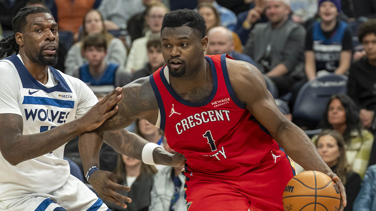 New Orleans Pelicans forward Zion Williamson (1) drives to the basket past Minnesota Timberwolves center Naz Reid (11) in the second half at Target Center.