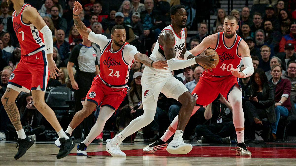 Jan 16, 2025; Portland, Oregon, USA; Portland Trail Blazers center Deandre Ayton (2) looks to pass the ball during the first half against LA Clippers guard Norman Powell (24) and center Ivica Zubac (40) at Moda Center. Mandatory Credit: Troy Wayrynen-Imagn Images