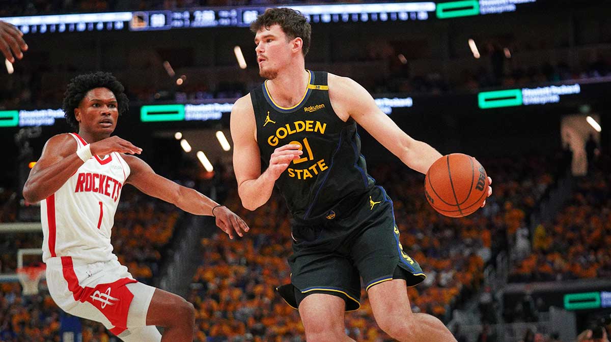 Golden State Warriors center Quinten Post (21) dribbles past Houston Rockets forward Amen Thompson (1) in the third quarter of game six of the first round for the 2025 NBA Playoffs at Chase Center.
