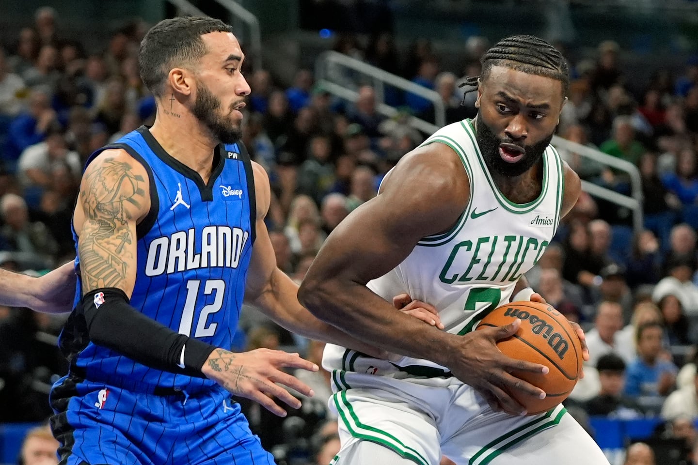 Jaylen Brown had a game-high 35 points, but Orlando's Trevelin Queen (left) tied a career high with 17 points as the Magic rallied from a 15-point halftime deficit for the victory.