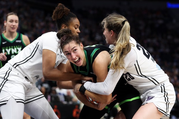 Jessica Shepard #15 of the Minnesota Lynx defends the ball against Iliana Rupert #12 of the Golden State Valkyries and Kate Martin #20 during the fourth quarter in game one of the first round of the WNBA Playoffs at Target Center on Sept. 14, 2025 in Minneapolis, Minnesota. NOTE TO USER: User expressly acknowledges and agrees that, by downloading and or using this photograph, User is consenting to the terms and conditions of the Getty Images License Agreement. (Photo by Matt Krohn/Getty Images)