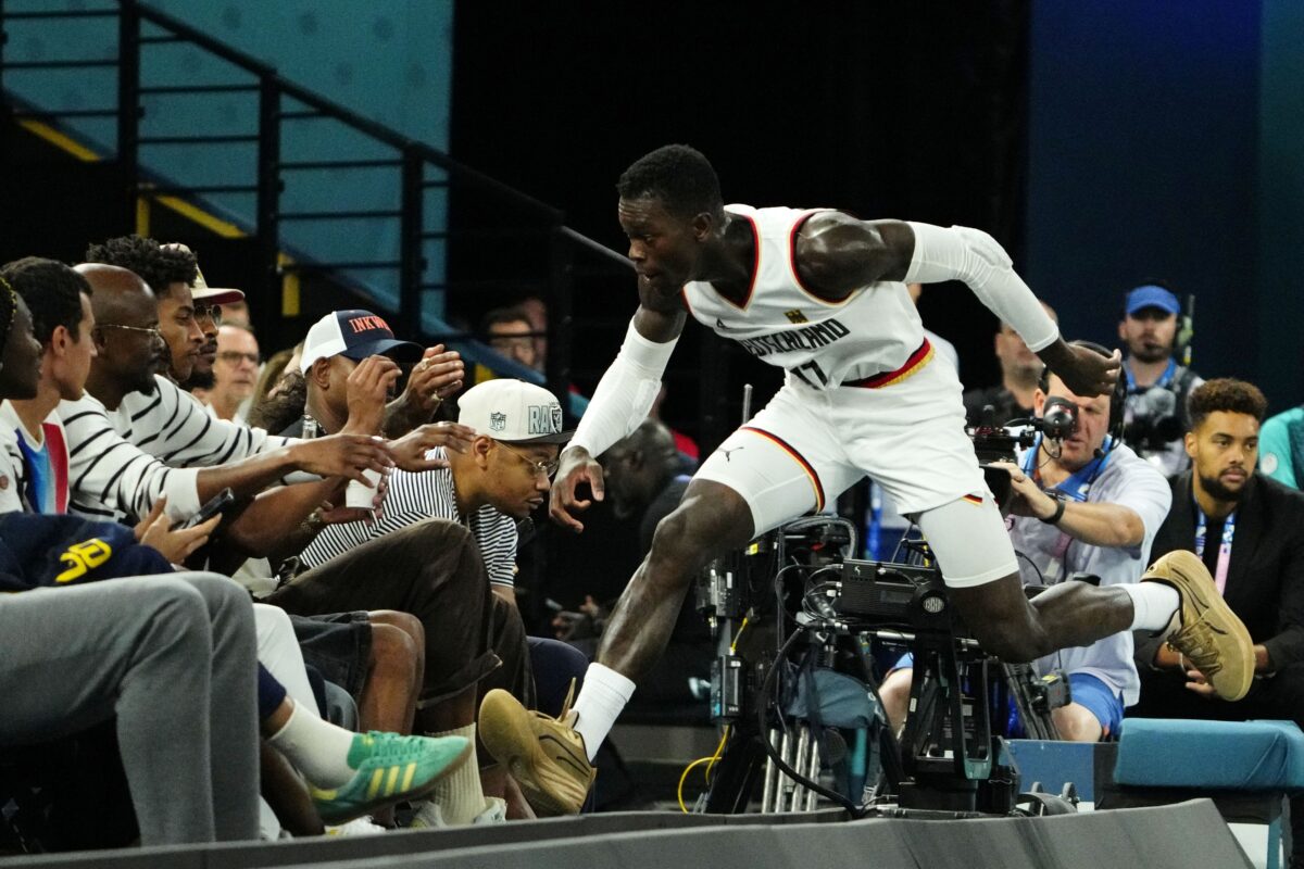 Germany point guard Dennis Schroder (17) jumps towards the seat after making a play for the ball against Serbia in the men's basketball bronze medal game during the Paris 2024 Olympic Summer Games at Accor Arena.