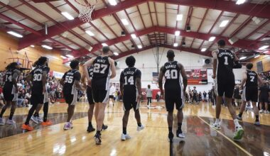 San Antonio Spurs players make a surprise visit to Tom Moore High School in Ingram, Texas, to visit the students and families of those impacted by flooding that killed more than 130 people across the region,Wednesday, Sept. 10, 2025. (AP Photo/Eric Gay)