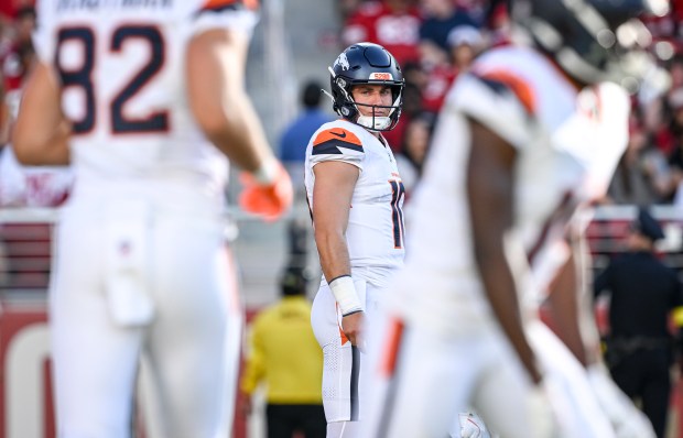 Bo Nix (10) of the Denver Broncos looks at Adam Trautman (82) of the Denver Broncos before taking the snap against the San Francisco 49ers during the first quarter at Levi's Stadium in Santa Clara, California on Saturday, Aug. 9, 2025. (Photo by AAron Ontiveroz/The Denver Post)