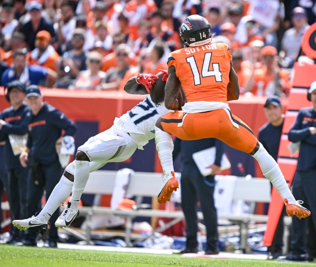Roger McCreary (21) of the Tennessee Titans picks off a...